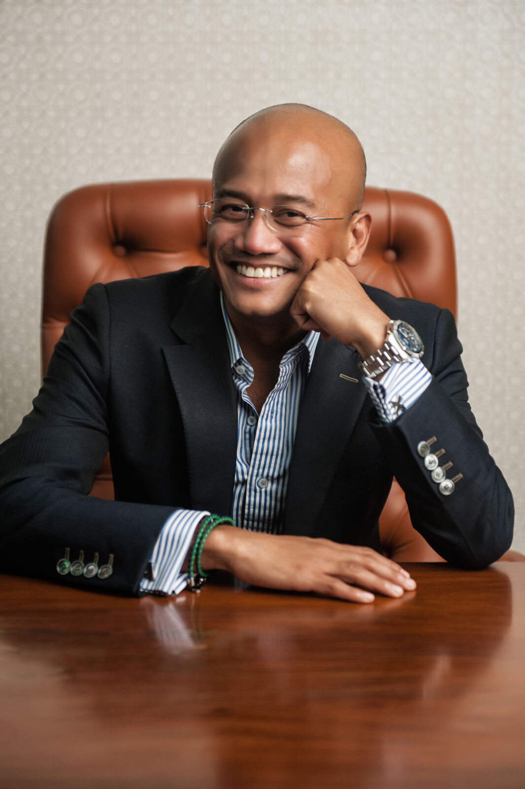 AirAsia X CEO Azran Osman-Rani smiling at a boardroom table